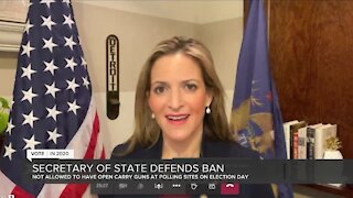 Secretary of State defends firearms ban at polls