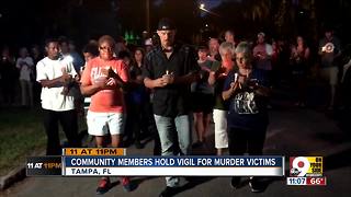 Community members hold vigil for murder victims
