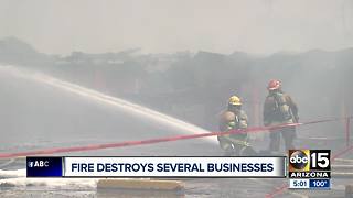Fire destroys several businesses at Phoenix strip mall threatened homes