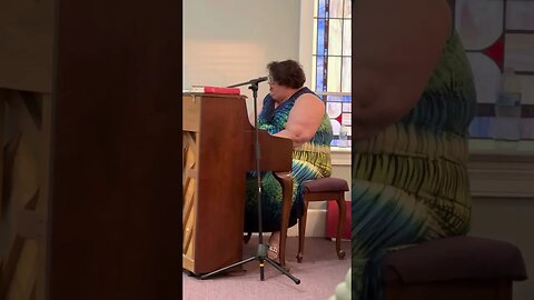 Penny Davis singing during revival services at Sandy Bottom Baptist Church in Kinston, NC