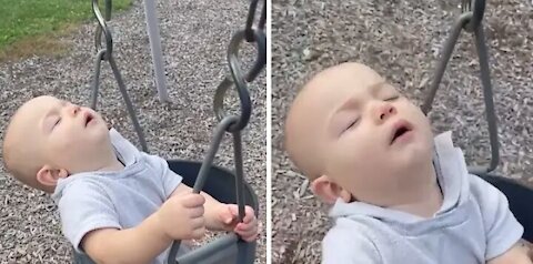Drowsy baby takes a nap during swing ride #Shorts
