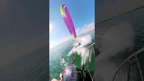 High-Flying Thrill : Jet Ski Rider Attempts to Touch Paramotor in Flight