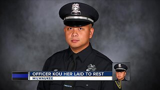 Burial procession for officer Kou Her