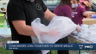 Coworkers join together to serve meals