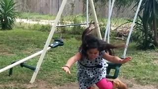 Girl Fails In Jumping Off Swing