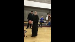 75 Year Old Priest Makes Crazy Shot, Crowd Goes Wild