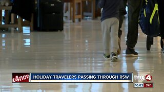 Holiday travelers passing through RSW