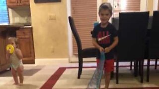 Dad hits son with slinky