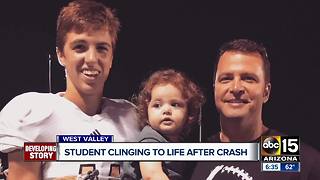 Student clinging to life after crash
