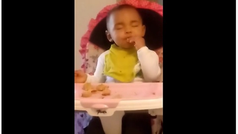 Tired Baby Practically Falls Asleep While Eating Her Favorite Snack