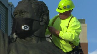 Curly Lambeau and Vince Lombardi statues get face masks