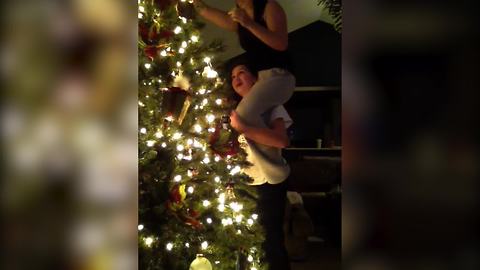 "Two Girls Fail At Getting Star On Top Of Christmas Tree"