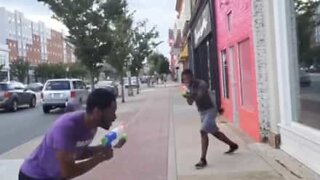 Youth challenge strangers to water gun duels