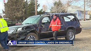 Drive loses control, lands on greenbelt