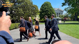 Biden Clown Show team is surrounding him as he walks to the White House to keep him away from the press.