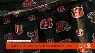 Hundreds of fans perform game day rituals