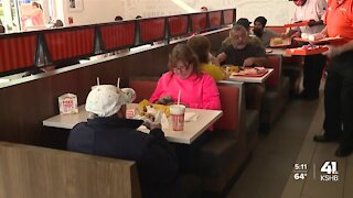 Customers brave long lines for the grand opening of Whataburger