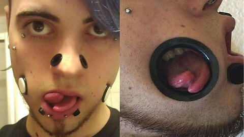 German man takes body art to the next level with cheek holes, forked tongue - TomoNews