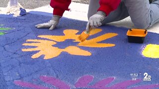 Bee Safe Crosswalk painted outside Johnston Square Elementary School