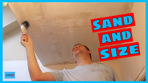 Sanding and sizing a ceiling.