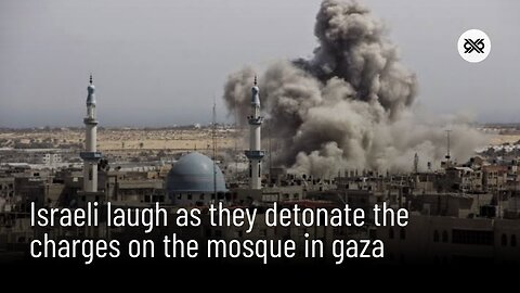 Israeli occupation sappers laugh as they detonate the charges that they have planted on the mosque