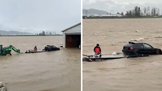 Car saved by tractor from heavy flood damage