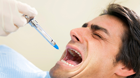 Dad's turn to get the needle at the dentist.