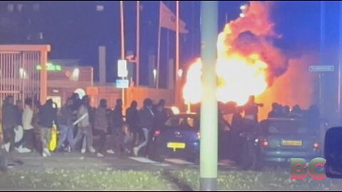 Four police hurt in Hague riots after rival Eritrean mobs torched cars, trashed buildings