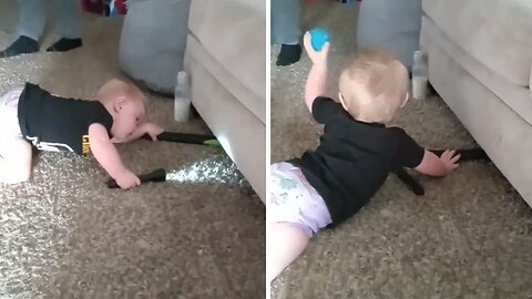 Baby Uses Flashlight To Fetch Ball From Under Couch