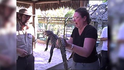 "Woman Too Scared to Hold Baby Alligator"