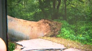 Road washed away by floods in Washington County