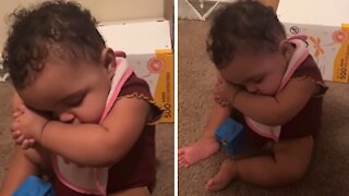Tired toddler falls asleep in adorably funny position