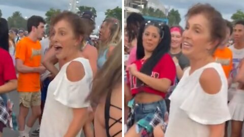 Elderly woman dances her heart out at concert