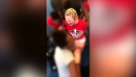 VIDEO: Cheerleader forced to do split despite pleas to stop