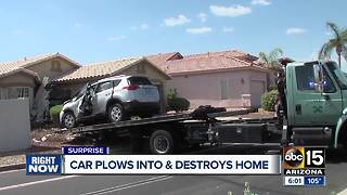 Car crashes into Surprise home, driver hurt