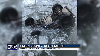 Vehicle rolls over into icy creek after crash in Walton Township