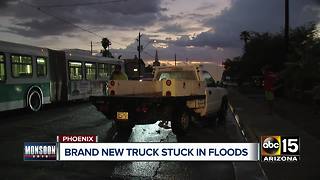 Driver gets brand new truck stuck in Phoenix flood waters