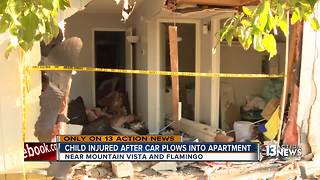 Child injured after car plows into living room