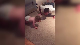 "Baby Loves Exercising With Dad"