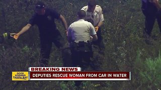 Deputies rescue woman trapped in car in water-filled ditch