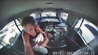 Watch as a Texas woman breaks out of handcuffs, steals police car