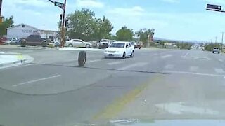 Driver let down as new tire spins free and hits oncoming car