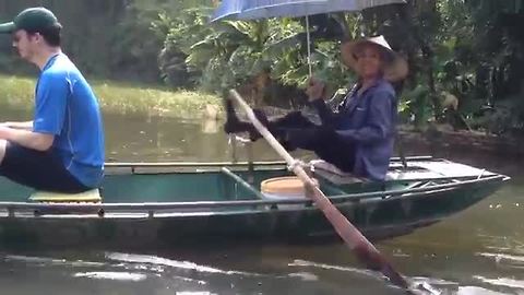 Tour guide in Vietnam incredibly rows boat with his feet