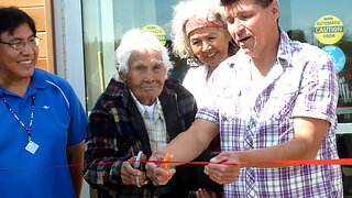 Old Trapper Cuts the Ribbon