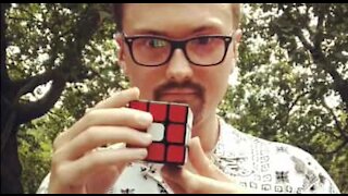 Young guy cracks Rubik's Cube in 30 seconds