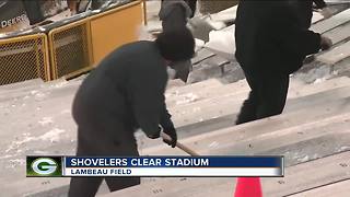 Shovelers clear Lambeau Field of snow