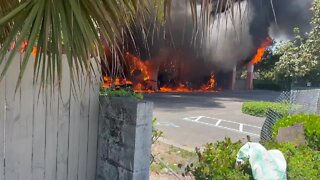 Flames visible during West Palm Beach car wash fire