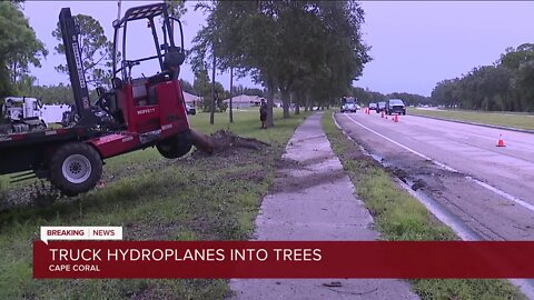 Semi-truck driver hospitalized after hydroplaning into trees