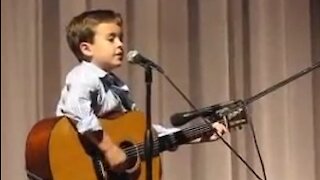 Boy Masters Guitar During Johnny Cash Cover Performance