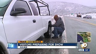 Visitors preparing for snow in San Diego mountains